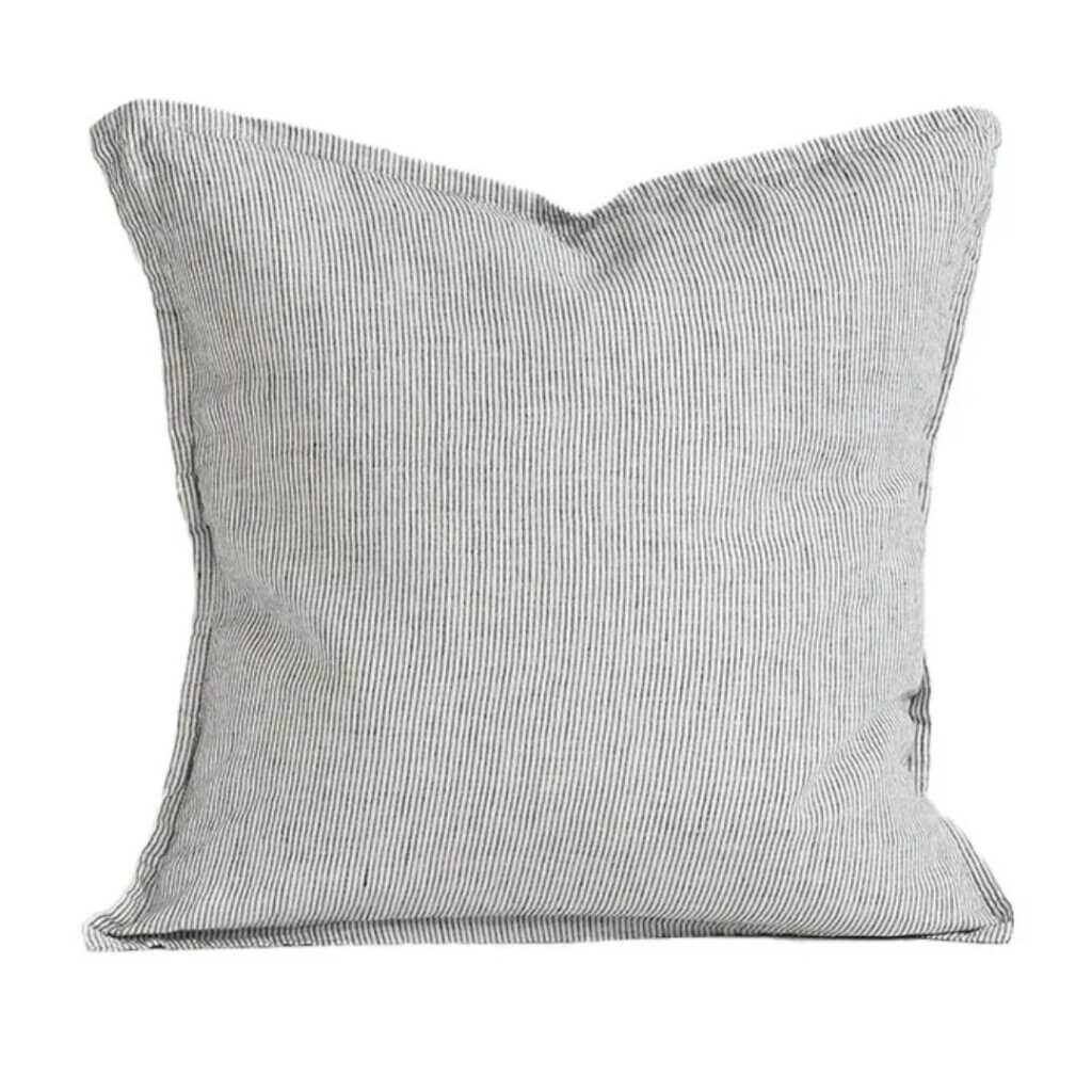 living room with grey - washed linen cushion